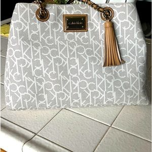Calvin Klein Monogram purse. Used and in a very good condition.